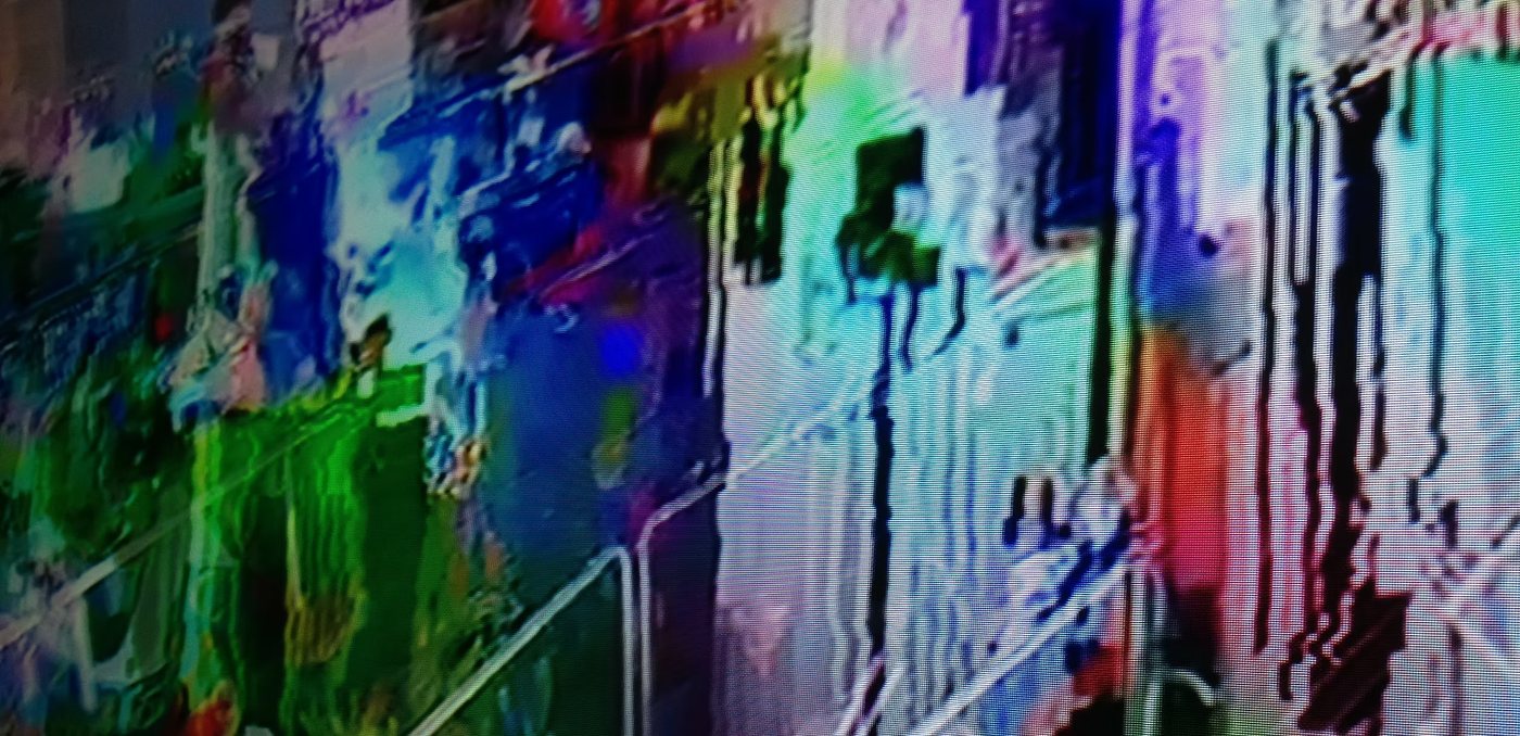 Elsewhere, a digital mixed-media work in streaks of blue, green, red, and violet.