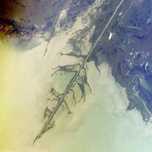 Photo from space of the Ural River delta, where the river splits into fingers of land that reach into the Caspian Sea.